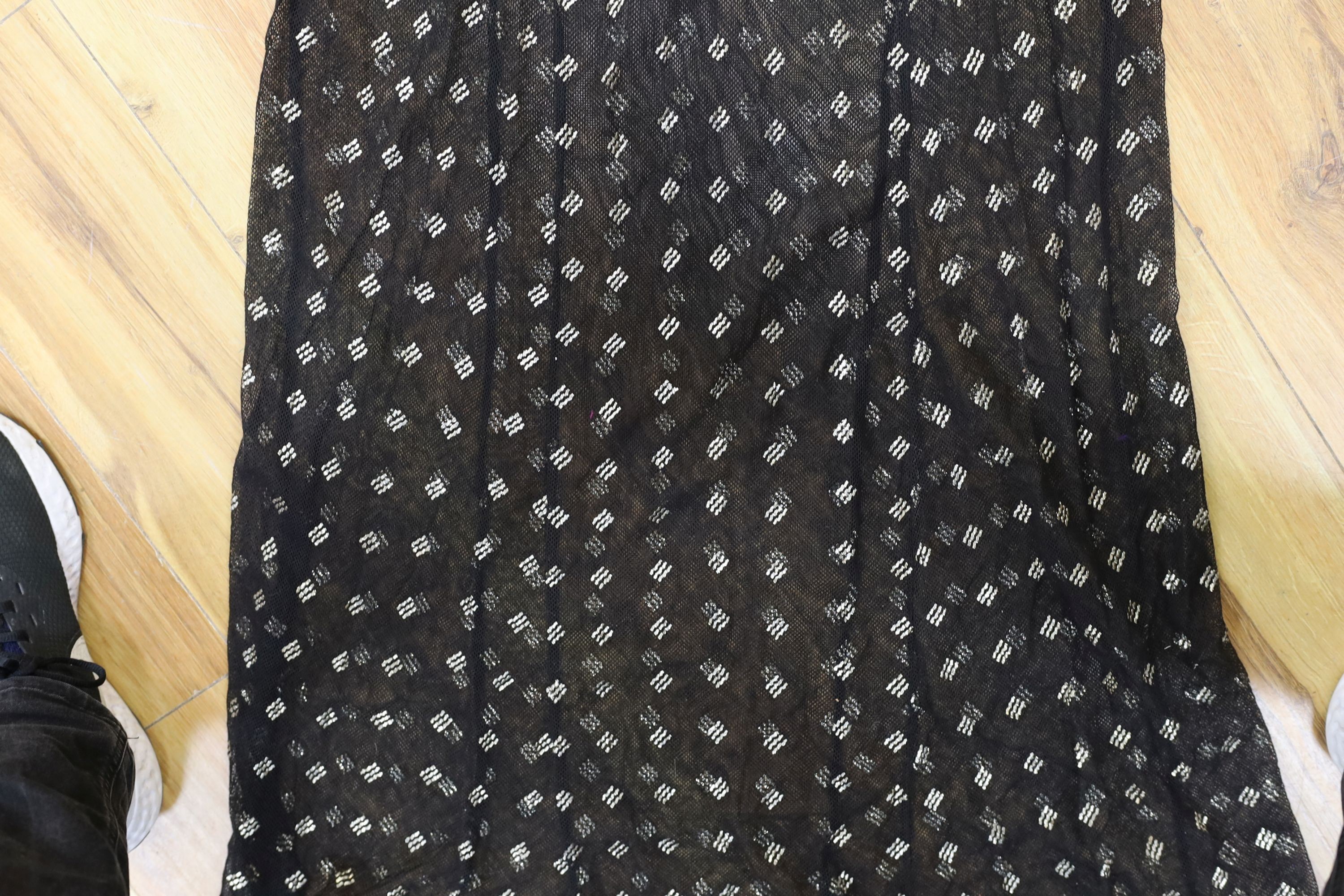 A dress made from a metal and black net Egyptian shawl; a similar shawl and a piece of shawl